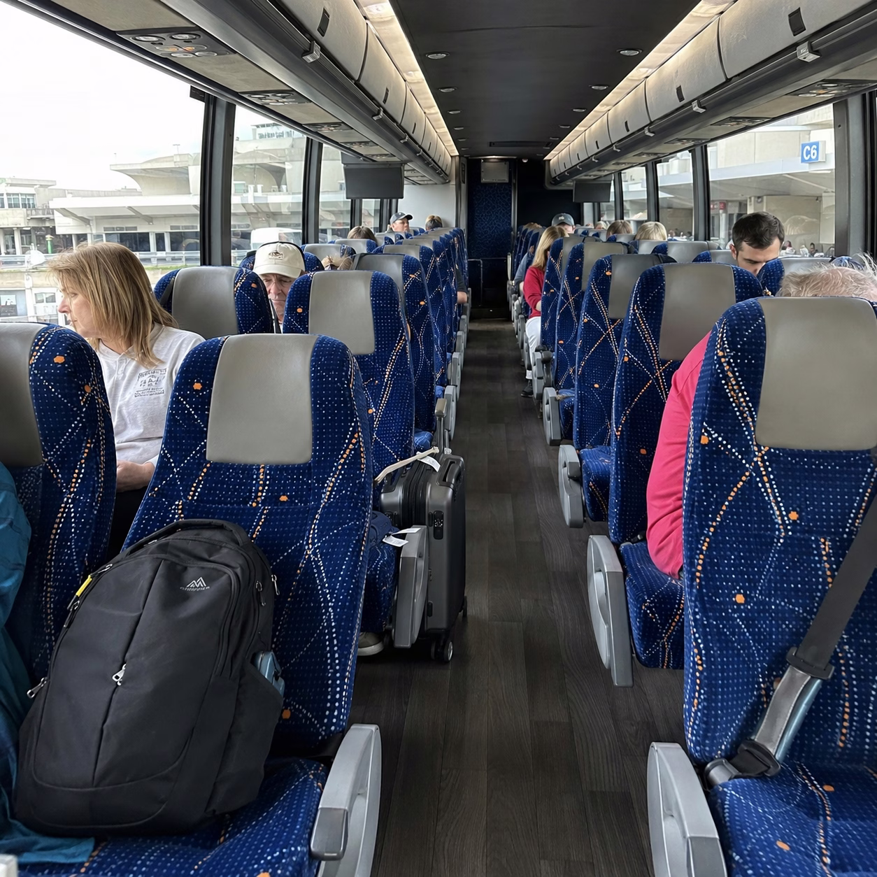 Airport transportation airport transportation charter bus interior passengers at airport in Hampton Roads