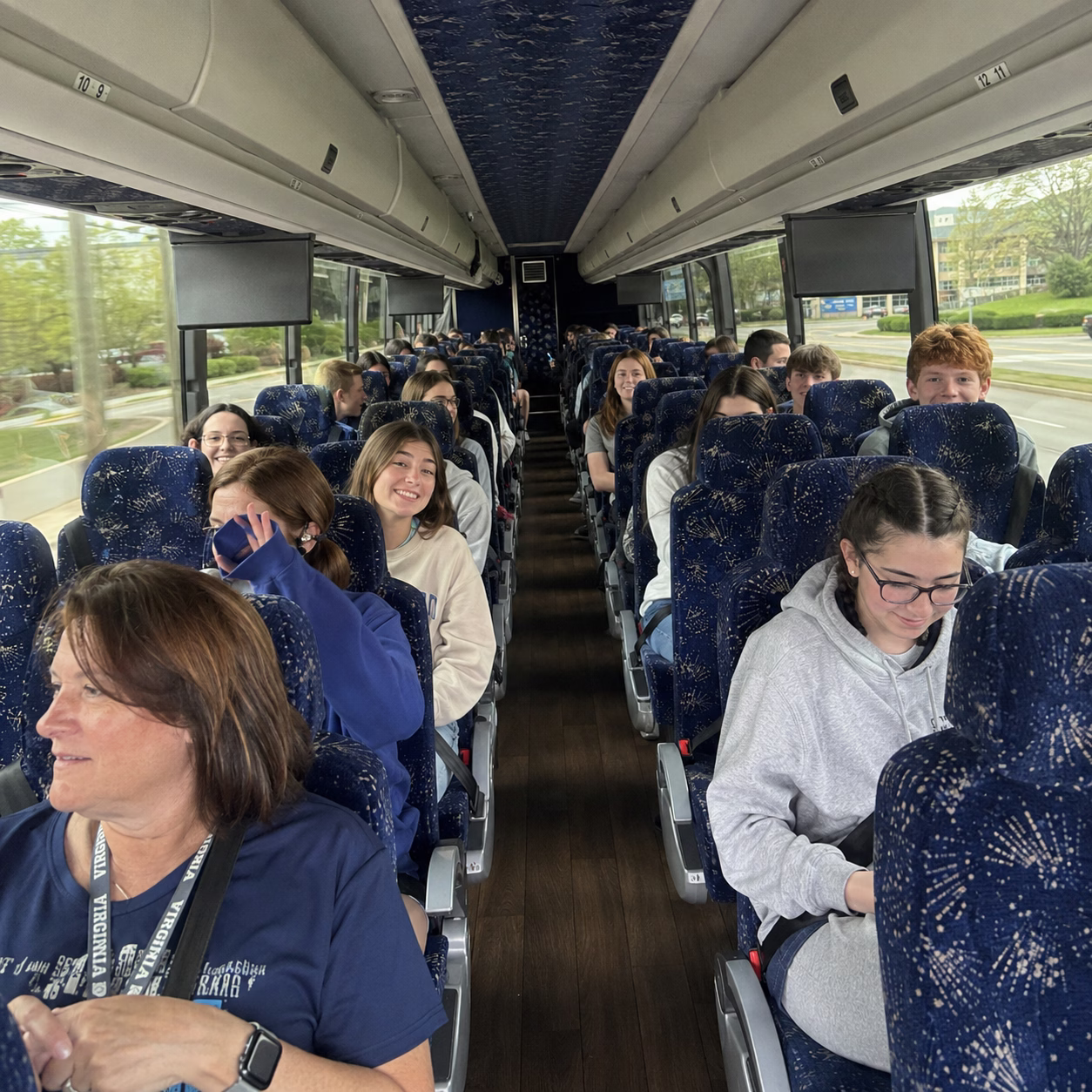 School event bus rental school event bus charter bus interior passengers school trip in Hampton Roads