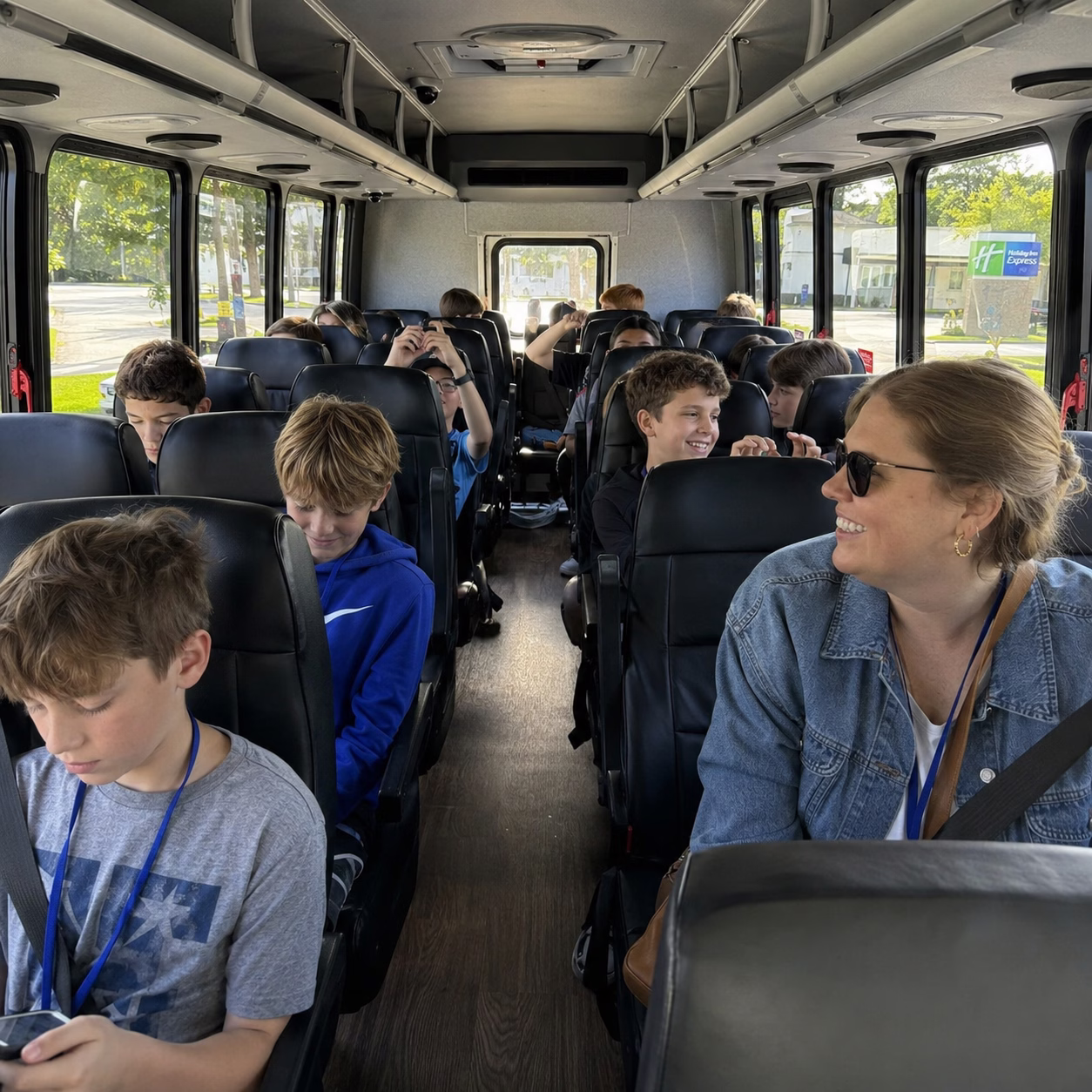 School event bus rental school event bus minibus interior passengers school trip in Hampton Roads