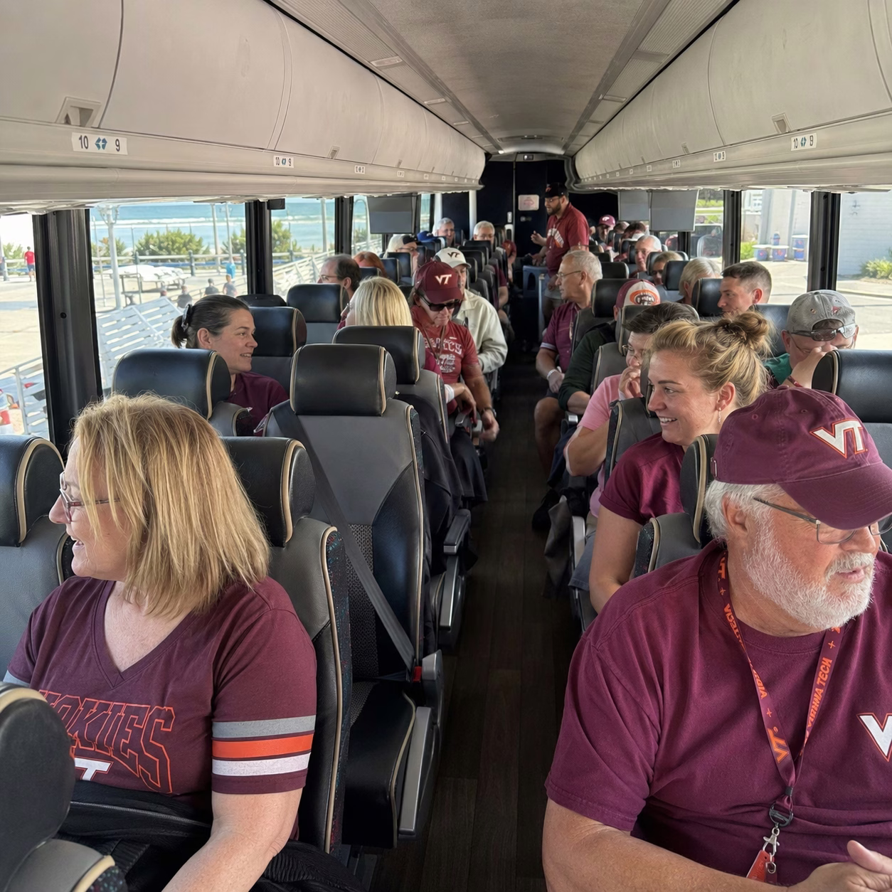 Sporting event party bus sporting event bus charter bus interior passengers in Hampton Roads